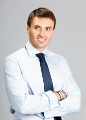 Portrait of business man, over gray background