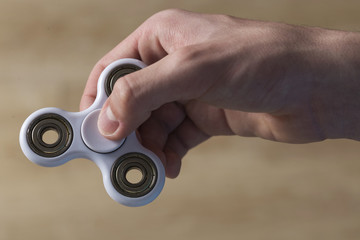 Boy playing with fidget spinner toy