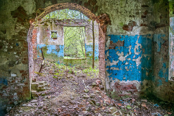 Old abandoned factory building in the forest in Moscow region, Russia