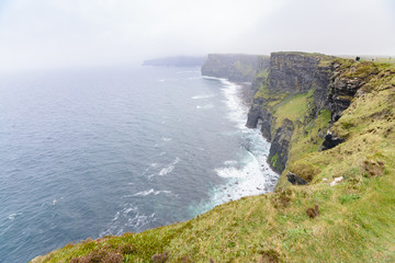 amazing cliffs of Moher on foggy day, Ireland