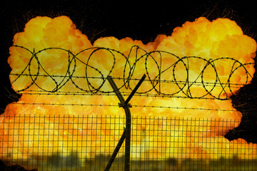 Realistic orange fire explosion behind restricted area barbed wire fence