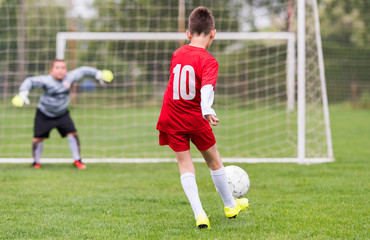Kids soccer football - children players match on soccer field
