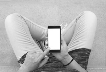 Woman holding modern smartphone. Horizontal mockup. Replaceable with own design. Portrait mode,...