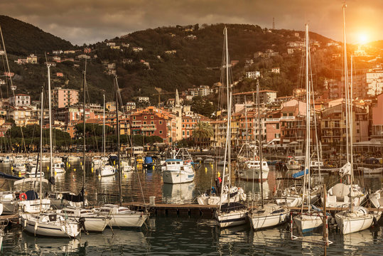 View of yachts and waterfront at sunset, Lerici, Liguria, Italy