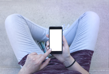 Woman holding modern smartphone. Horizontal mockup. Replaceable with own design. Portrait mode,...