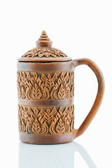 Antique rusty grunge sculptured cray cup on white background