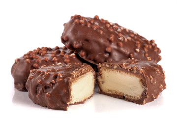 chocolate candy with white cream filling isolated on white background