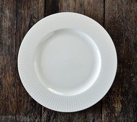 white plate on wooden