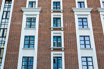 Fototapeta premium The facade of the house or hotel. The Windows and decoration of walls