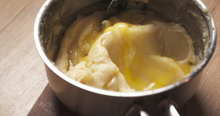 preparing choux dough in saucepan, 4k photo