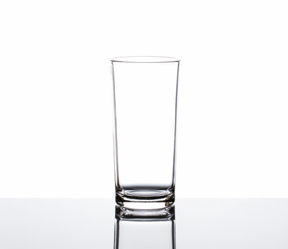 Clean empty drinking glass on white background