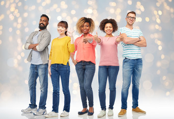 Fototapeta premium international group of happy people over lights