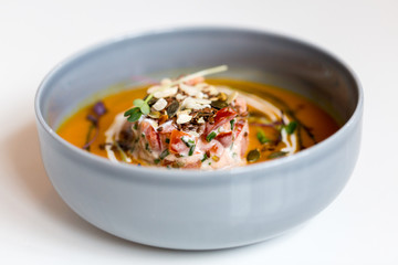 close up of vegetable pumpkin-ginger soup in bowl