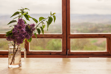 Lilacs in Glass Bottle