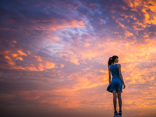 woman and beautiful cloud scape