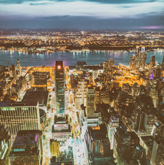 Twilight aerial view of Manhattan. City lights and traffic