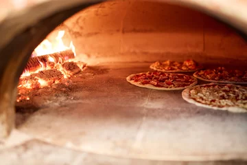 Foto op Canvas pizza baking in oven at pizzeria © Syda Productions