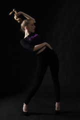 Vogue dancer posing on dark background