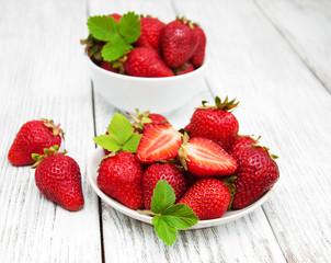 ripe strawberries on wooden table