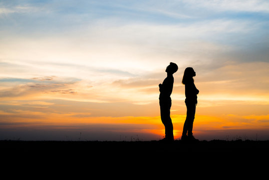 Silhouette, couple young stand with sunset.