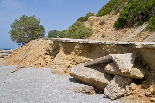 A road in bad conditions near the coast on the isle of Crete, Greece