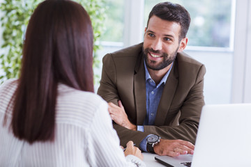 Businessman and businesswoman working