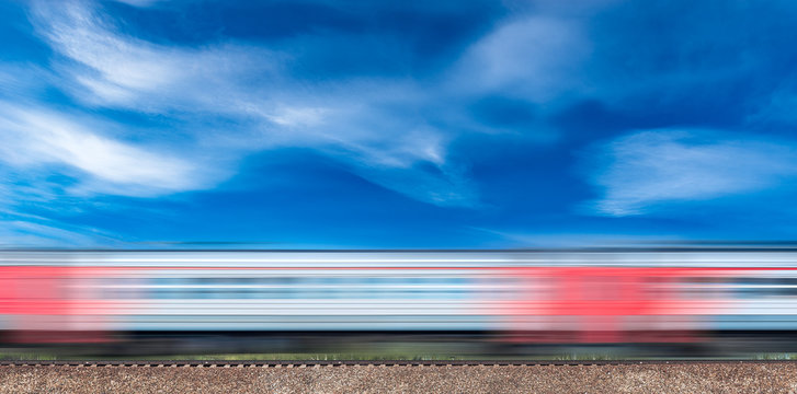Fototapeta Highspeed train moves on the hill.