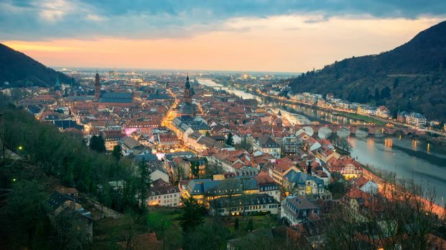 Heidelberg, Germany, timelapse footage of aerial view, with dreamy dusk sky, evening lights and Neckar river