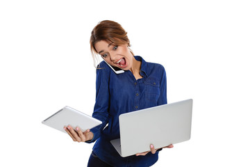 Unexpected surprise. Young woman speaks on the phone and holds a laptop in her hands screaming at him with her mouth open, standing on a white background