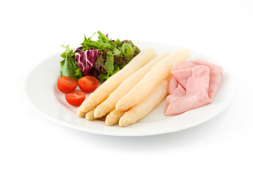 White asparagus with salad and ham isolated on white background

