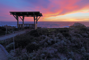 Sunset behind a public gazebo at Asilomar State Beach in California