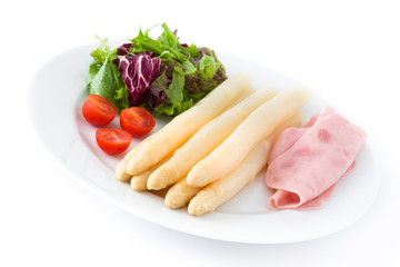 White asparagus with salad and ham isolated on white background

