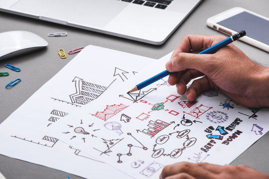 Business concept. Businessman writing idea sketch