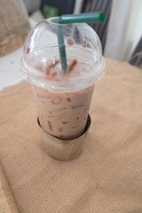 Iced Mocha coffee with green straw