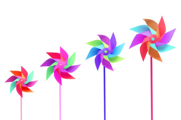 Toy windmill propeller set with multicolored blades isolated on white