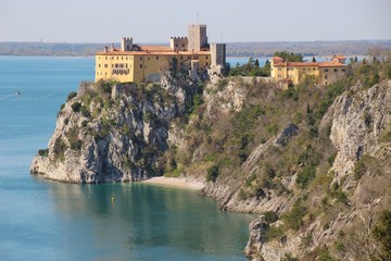 Duino Castle, a fortification of the 14th century  in the Gulf of Trieste, seen from a panoramic footpath called Rilke trail. Northeastern Italy, Europe.