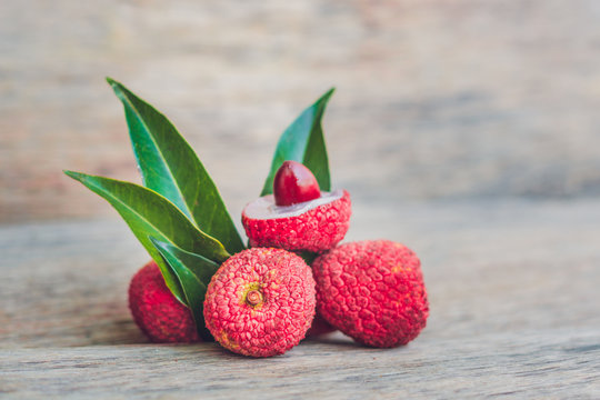 Fresh litchi fruit on an old wooden background