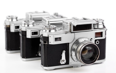 Old camera on white background on desk