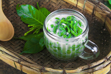 Thai dessert, rice noodles made of rice eaten with coconut milk on wooden table