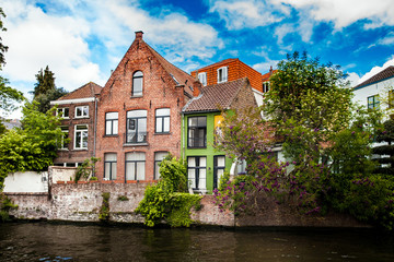 Fototapeta na wymiar Architecture of Bruges city, traditional houses view on the canal