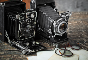 Old camera on an old background on a close-up table
