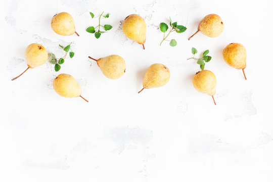 Fresh pears on white background. Flat lay, top view, copy space