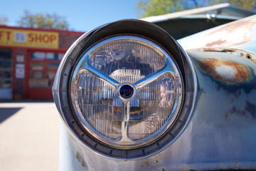 Headlight of an old abandoned automobile in Seligman, Arziona