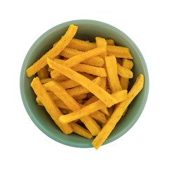 Top view of a bowl filled with sweet potato fries isolated on a white background.