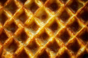 The texture is lush fresh Belgian waffles.Close