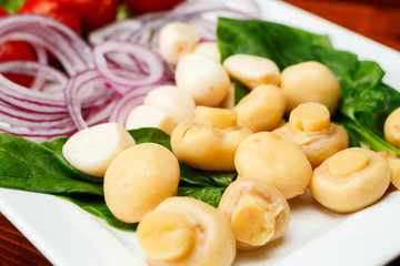 Different types of vegetables on white plate.