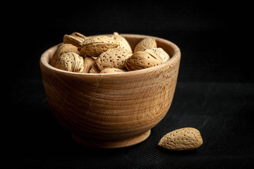 Almonds in a wooden bowl.