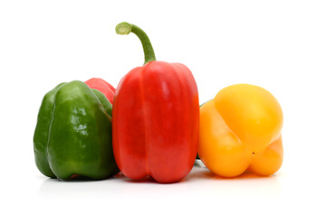 Fresh colorful bell peppers on the white background