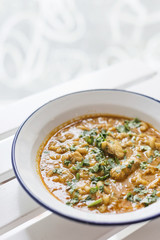 creamy spicy seafood fish soup with coriander