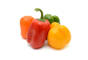 Fresh colorful bell peppers on the white background